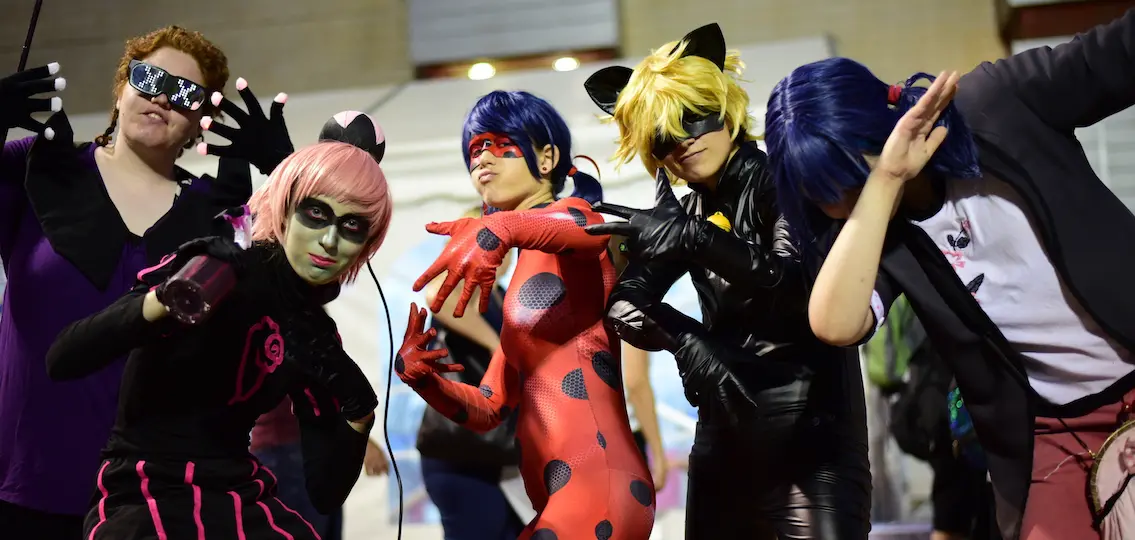 Teens cosplaying as Ladybug and Cat Noir