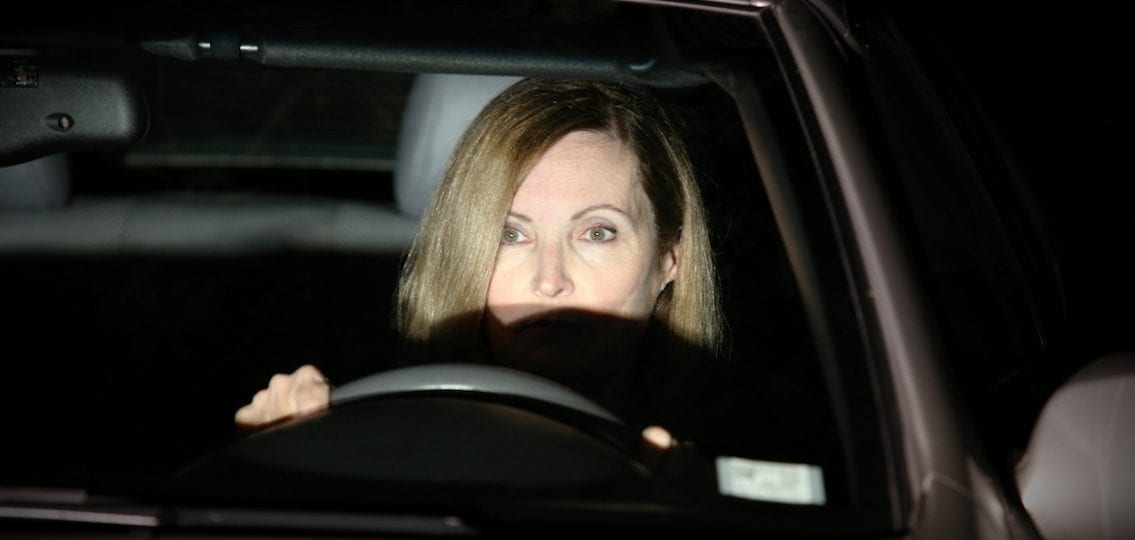 Mom driving in the car at night