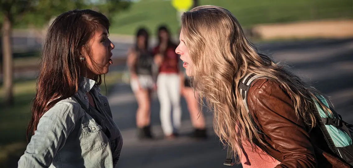 Two teen girls arguing