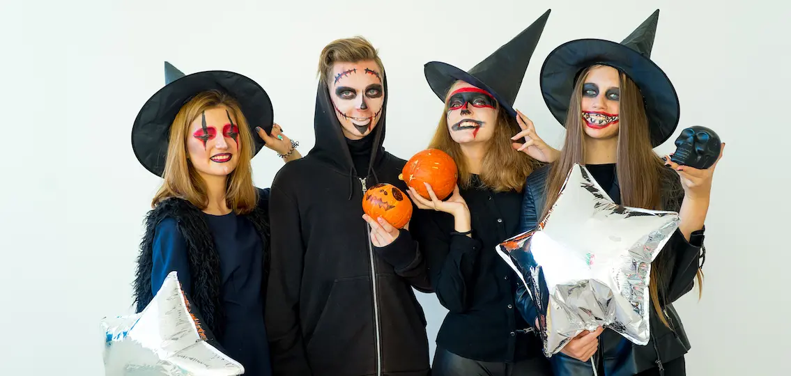 Girls as witches and skeletons on halloween