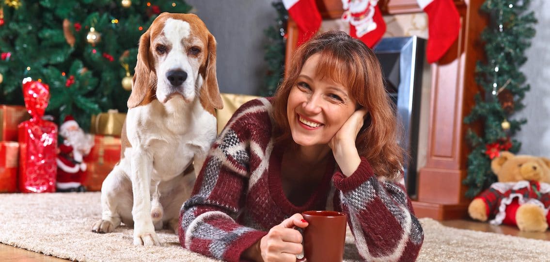 mom and hound dog celebrating christmas together
