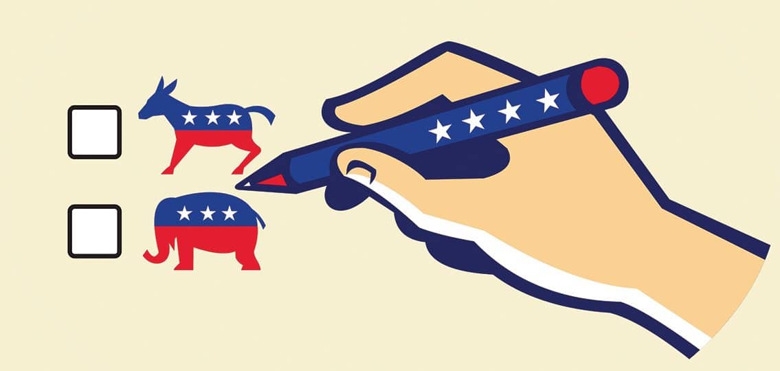 Hand Holding Pen Voting between democrat or republican