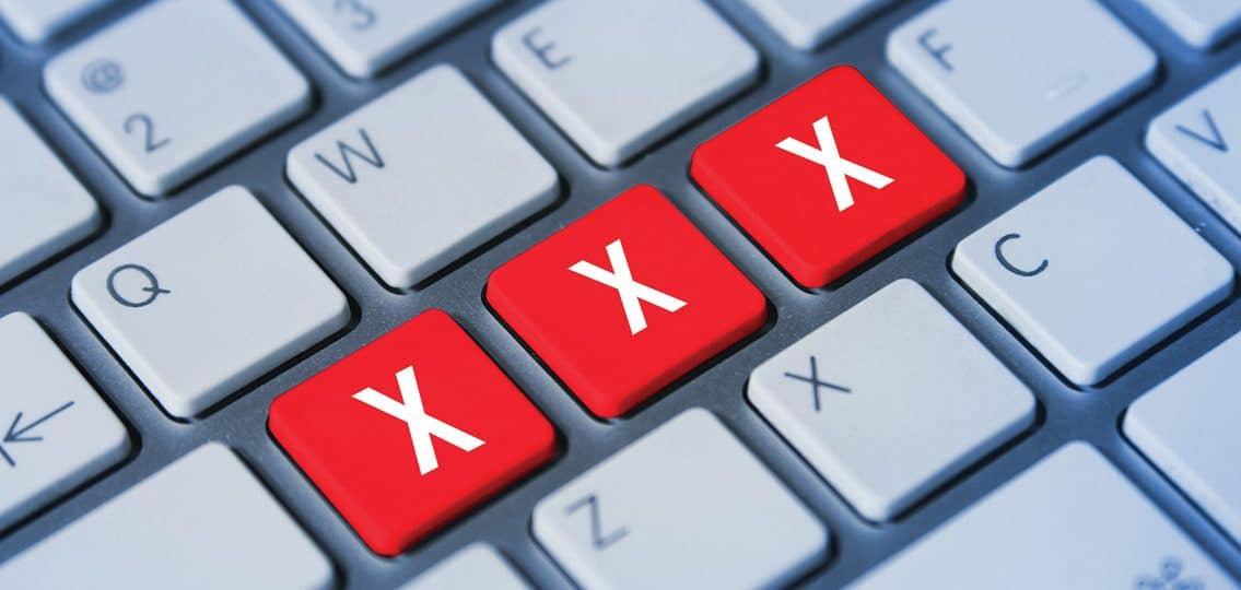 close up of a keyboard with xxx in red keys