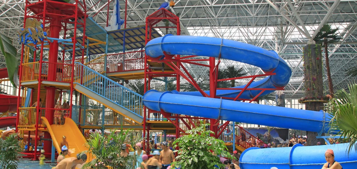 crowded indoor water park slides