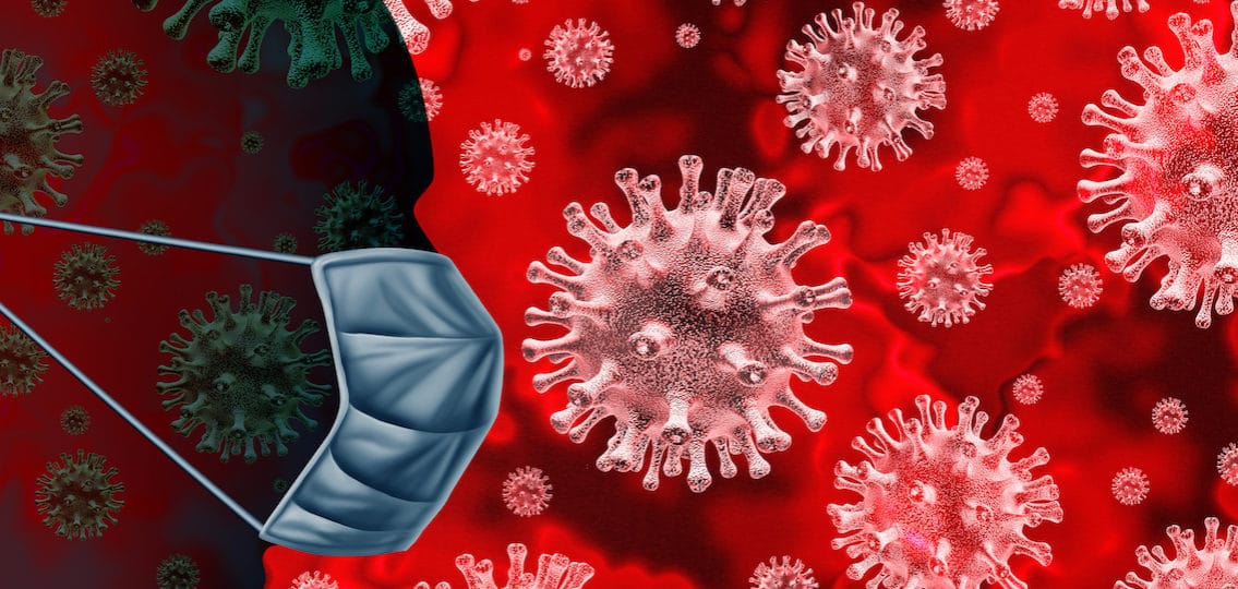 silhouette of a figure in a face mask surrounded by illustration of coronavirus