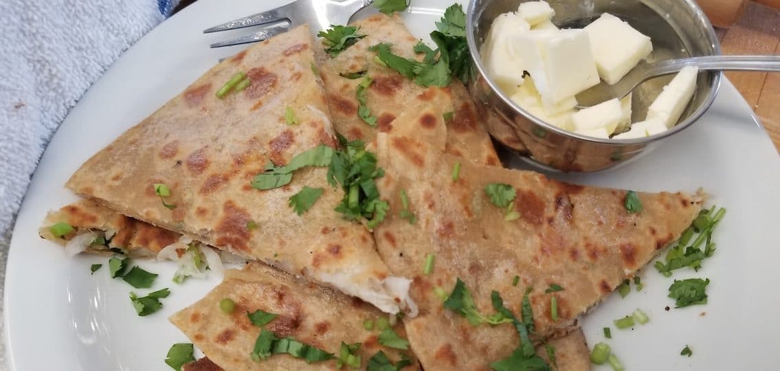 homemade partha naan flatbread on a plate