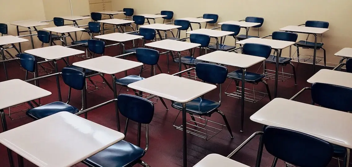 empty school classroom rows of desks