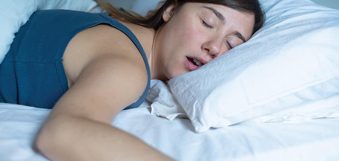 Face Close Up Portrait Of teen girl Sleeping In Bed And Snoring because of teen sleep apnea