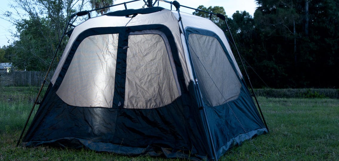 camping tent in a backyard in the evening, outdoor slumber party