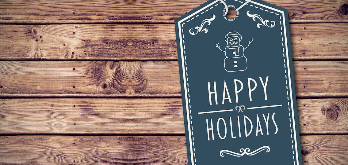 Happy holidays banner against wooden planks background Happy holidays banner against wooden planks background