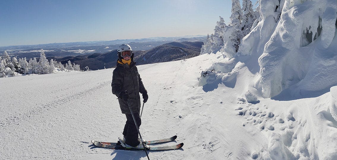teen boy skiing on a mountain
