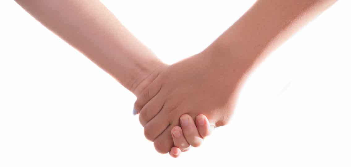 Best friends forever - BFF - Two 14 year old teenage girls holding hands - isolated on white