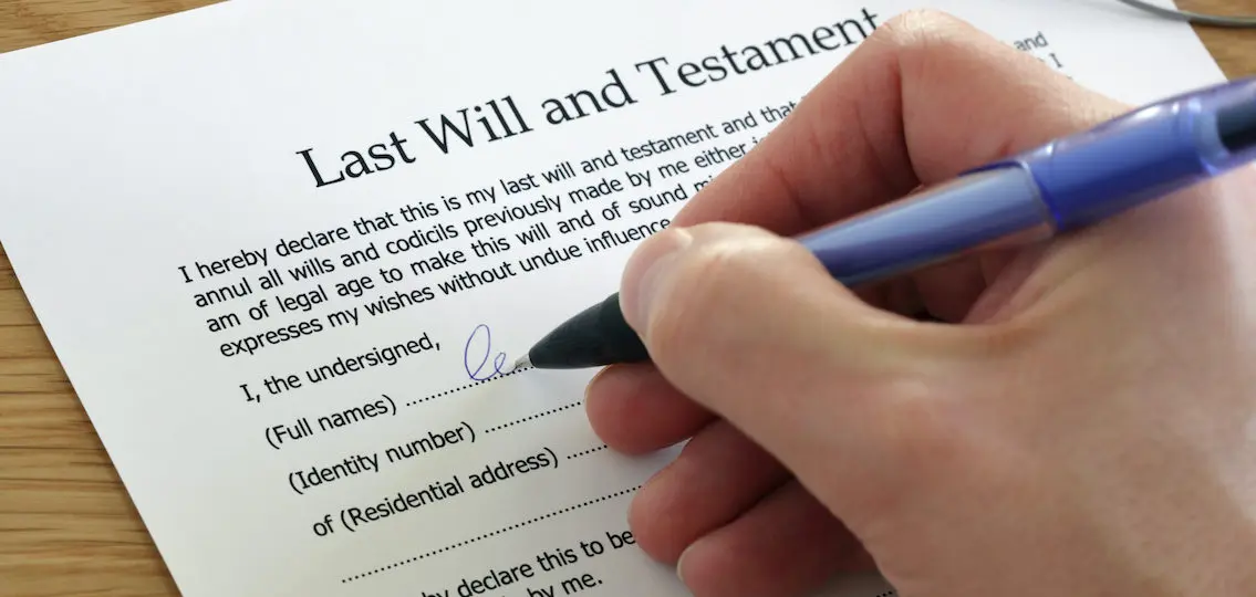 Signing Last Will and Testament document, family changing their will