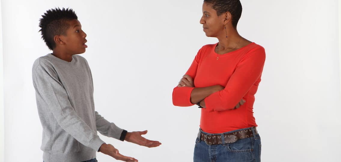 calm mother with arguing teen son