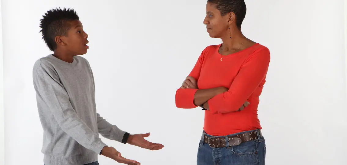 calm mother with arguing teen son