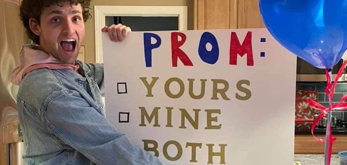 Author Christine Burke's son with a sign that says: Prom: yours, mine, both