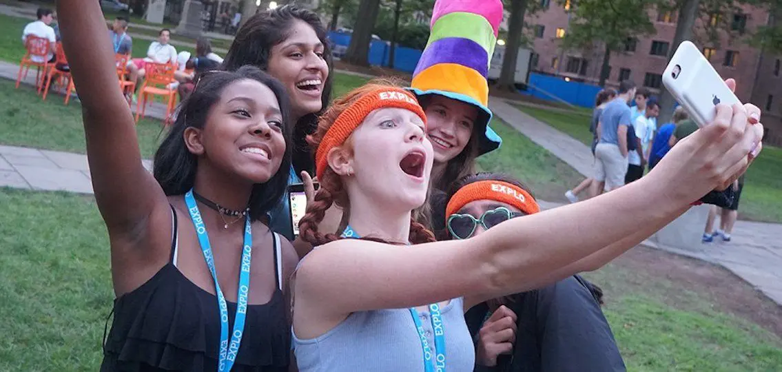 Teens with explo headbands taking a selfie at summer program