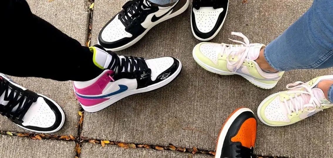 a close up of the author's sneaker collection on her sneakerhead family's feet