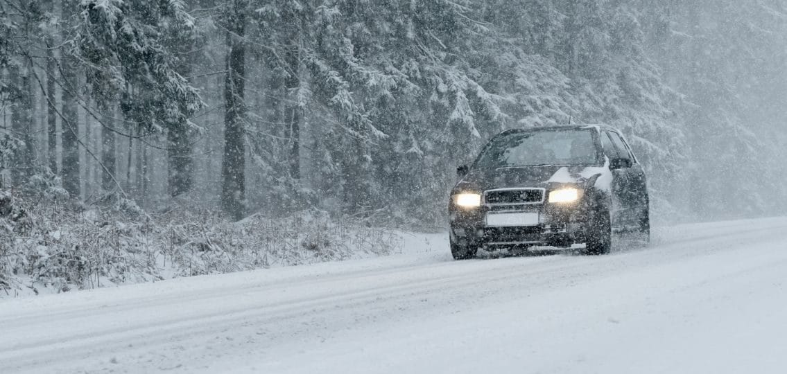 winter driving car teenager driving in winter weather using winter driving safety tips