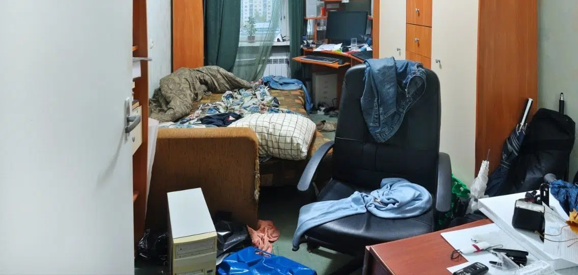 a teenage messy bedroom full of clothes