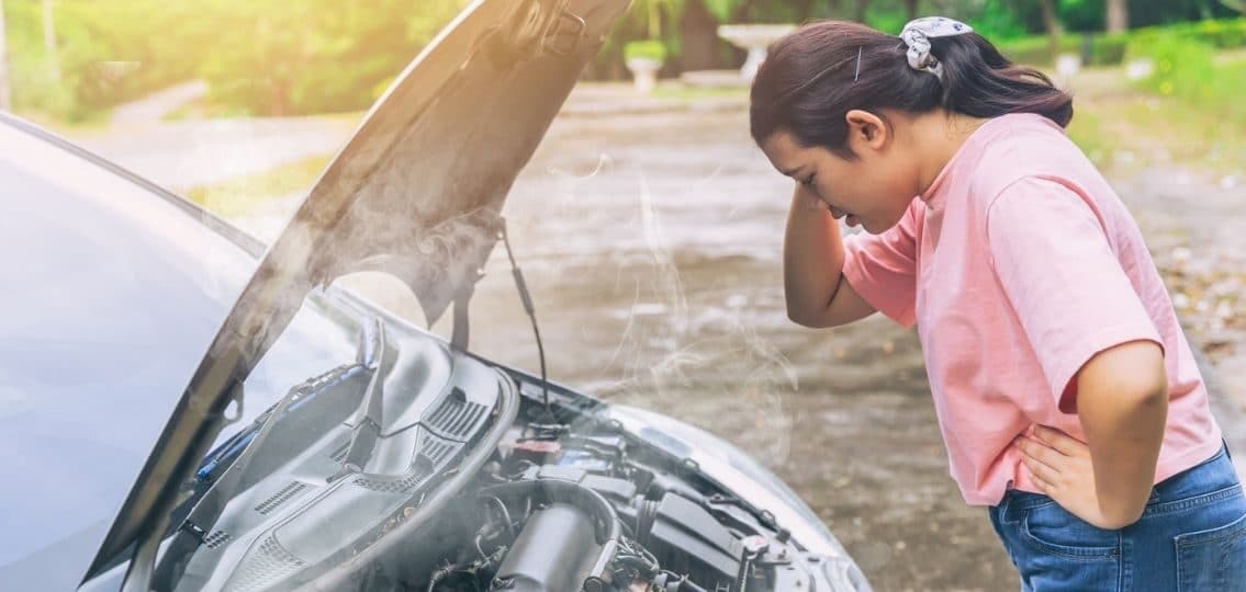 a teenage driver dealing with car maintenance summer driving safety struggles