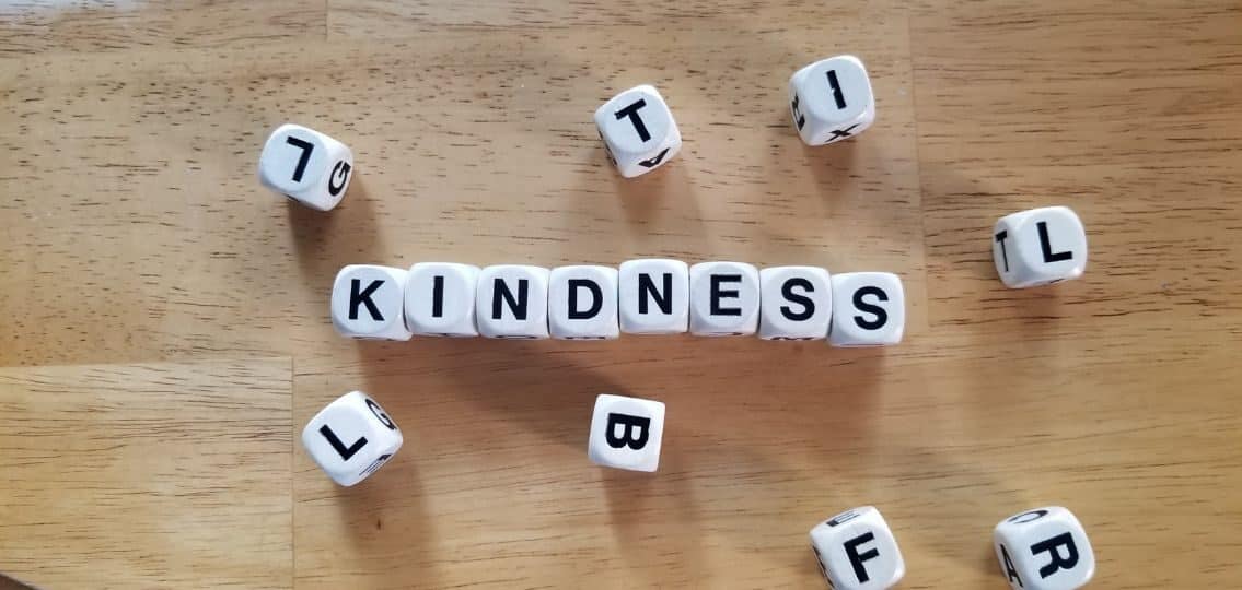 kindness spelled out in boggle blocks
