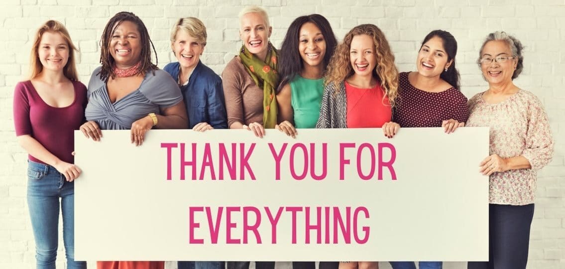 a group of women on mother's day celebrating women with sign saying thank you for everything