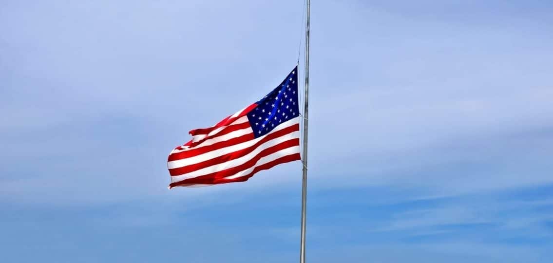 Coping with mass shootings mourning flag at half mast