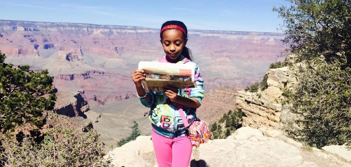 a picture of the author as a middle schooler reading for fun at the grand canyon