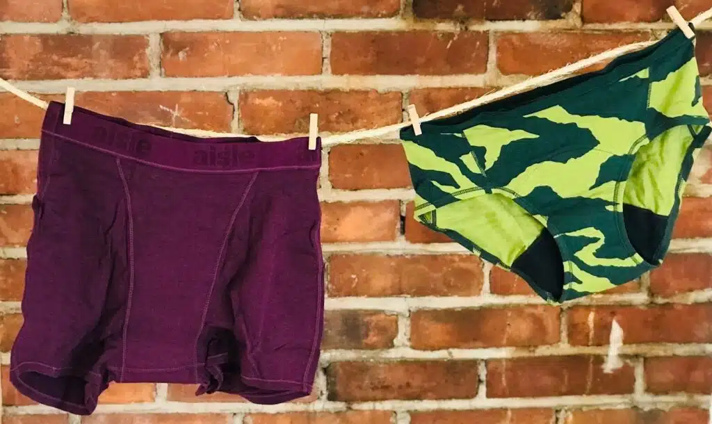 Two different styles of aisle period underwear hanging on a line