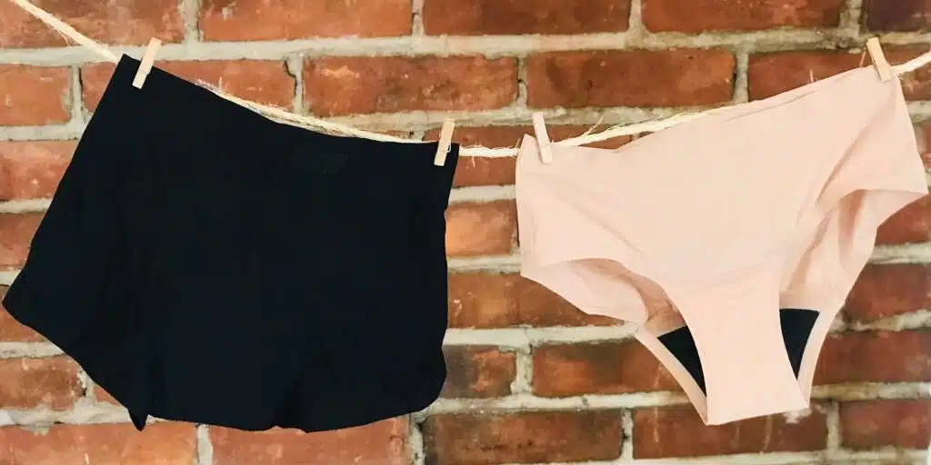 Two pairs of knix period underwear hanging on a line