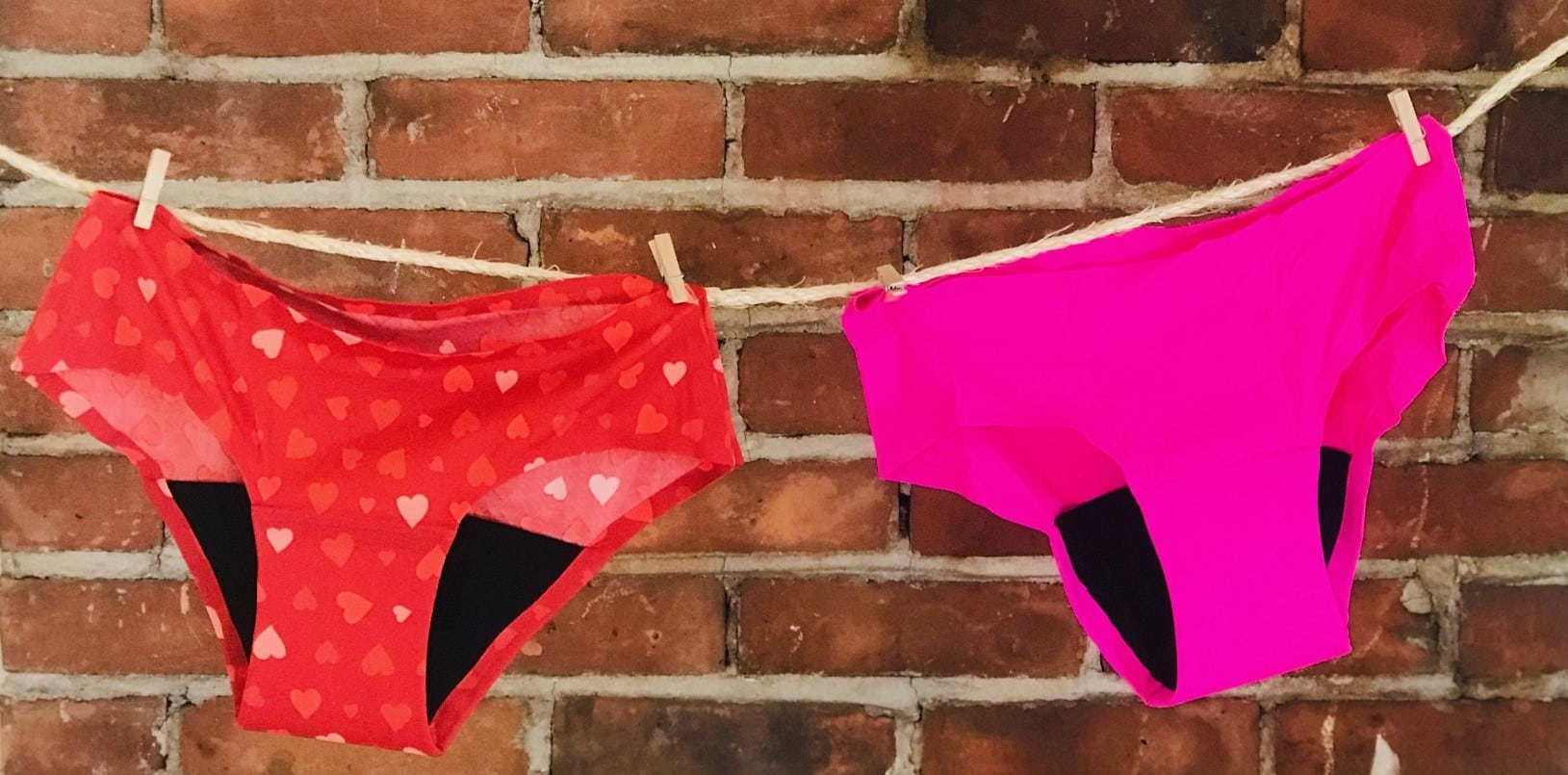 Two pairs of RubyLove period underwear hanging on a line