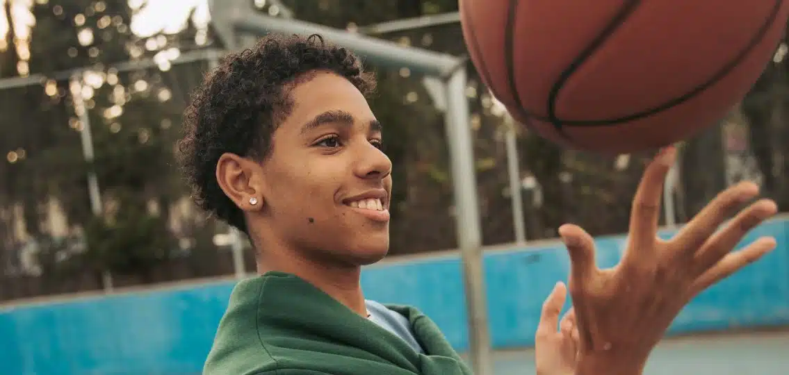 a teen boy with a basketball