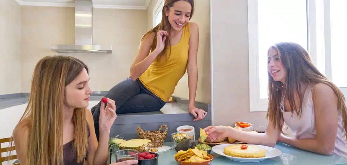 Teen girls on their period eating various food, some period friendly food and some not