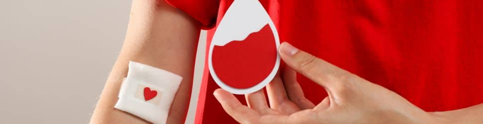 a 16 year old teenager close up on arm after donating blood for the first time
