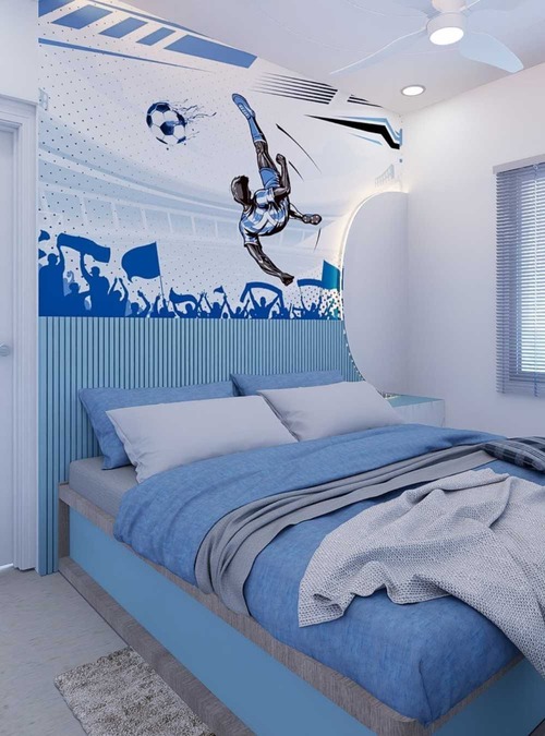 blue and white bedroom with soccer mural above the bed