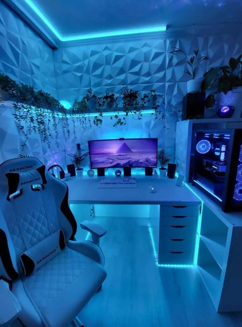 desk with gaming chair and computer monitor