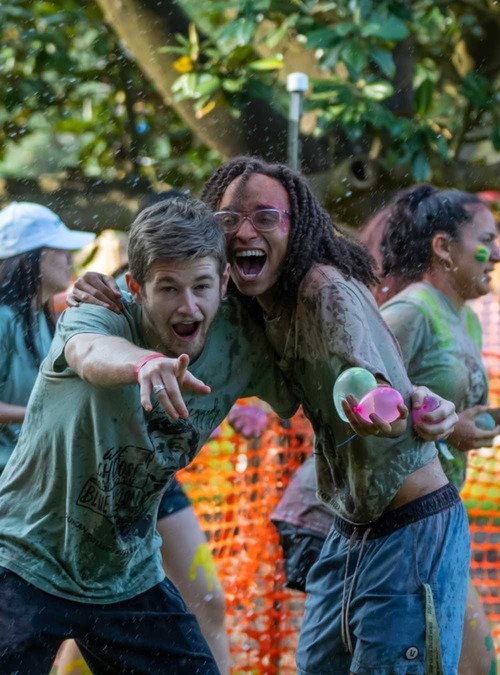 teens in a water balloon fight