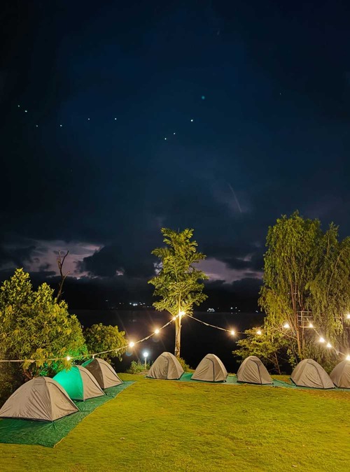 eight pup tents in a field