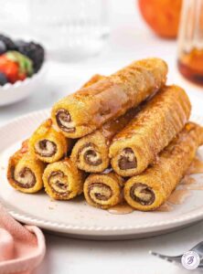 stack of french toast roll-ups on a plate
