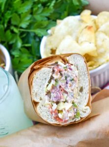 meat, cheese, and vegetables on a sandwich roll