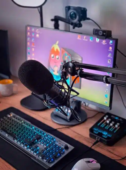 computer set up for streaming with camera, microphone, and sound board