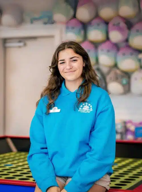 teen girl standing in an arcade
