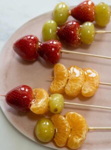 strawberries, grapes, and orange slices on skewers
